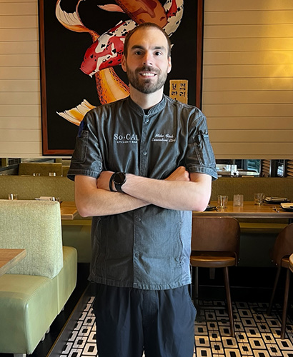 Executive Chef Mike Vick standing in the dining room at SoCal Kitchen + Bar in Columbus, Ohio's Short North